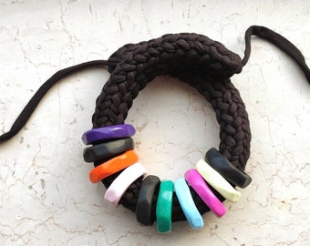 Bold statement necklace in t-shirt yarn and polymer clay rings.