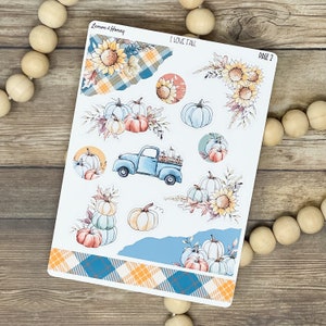 May include: A sheet of fall-themed planner stickers with watercolor illustrations. Designs include pumpkins, sunflowers, a blue truck, and plaid patterns. The text "I LOVE FALL" and "PAGE 2" are visible.