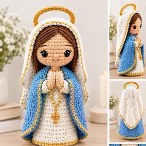 May include: A crocheted doll of a figure with brown hair, wearing a white and blue robe with a gold-trimmed halo. The figure has hands clasped in prayer and holds a gold-colored beaded rosary with a cross pendant hanging from the hands.
