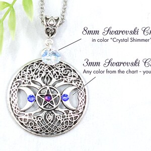 May include: Silver pendant necklace featuring a triple moon symbol with a pentagram inside, surrounded by a Celtic knot design. The pendant is adorned with three 3 mm blue Swarovski crystals and a single 8 mm clear Swarovski crystal.