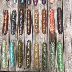 Guandules- beanpod, colorful, wall-relief, sculptures in clay