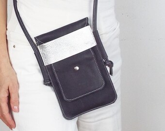 Leather cross body phone bag/pouch with card slots.