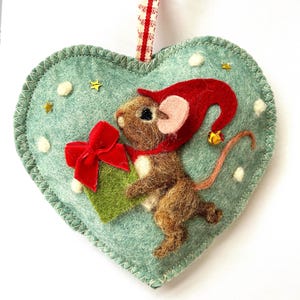 Needle felted Christmas pixie mouse on a felt heart scented with spices, Santa’s helper mouse.