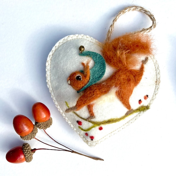 Needle felted Christmas squirrel on a felt heart scented with spices, Santa’s furry friend.