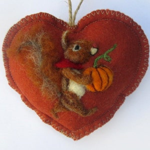 Halloween Heart hanging decoration, needle felted squirrel with a pumpkin on a heart -