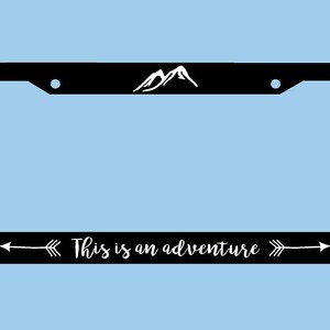 This is an Adventure License Plate Frame | Mountains Arrows Adventure License Plate Frame | Car Accessories License Plate Art