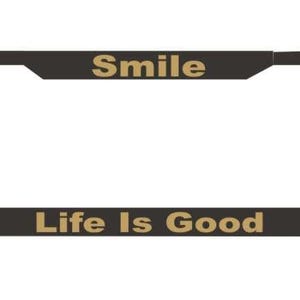 May include: Black license plate frame with the words "Smile" and "Life Is Good" in gold lettering. The frame has a rectangular shape with rounded corners and a solid black border.