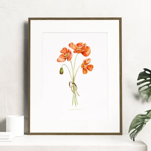 May include: A framed watercolor painting of a bouquet of orange poppies with green stems and leaves. The painting is on a white background and is framed in a brown wood frame.
