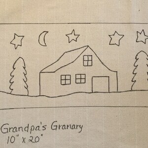 May include: Black and white line drawing of a barn with a moon and stars in the sky. The text "Grandpa's Granary 10" x 20" is below the image. The text "Primitives By Carol Rae" is on the left side of the image.