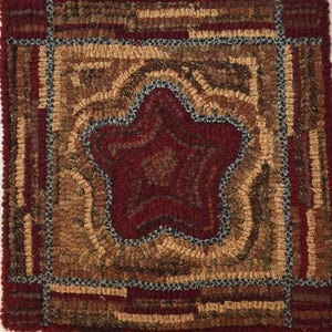 May include: A brown, tan, and red wool rug with a star-shaped design in the center. The star is surrounded by a decorative border.