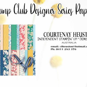 May include: A collection of patterned paper featuring floral designs in shades of blue, pink, yellow, and green. The paper is arranged in a grid pattern and includes a ribbon.