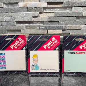 May include: Three Post-it Note Pads with humorous sayings. One pad reads "MEN HAVE ONLY TWO FAULTS: EVERYTHING THEY SAY AND EVERYTHING THEY DO." Another says "stressed for success." The third says "GOLFERS ALWAYS SCORE."