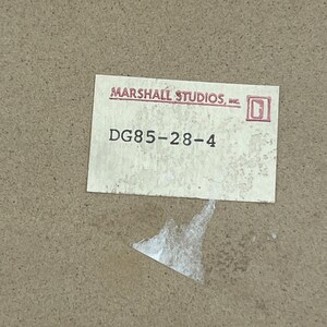 May include: A white label with the text "MARSHALL STUDIOS, INC." and a small square logo. Below the text is the number "DG85-28-4".