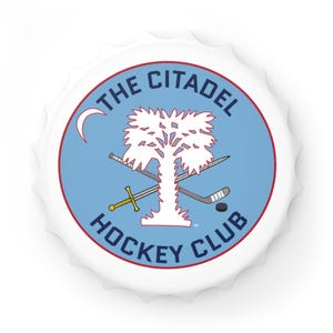 May include: White bottle cap with a light blue center featuring a tree, crossed swords, hockey stick, and puck. The text "THE CITADEL HOCKEY CLUB" is in a circular arrangement around the design. A crescent moon is in the upper left.