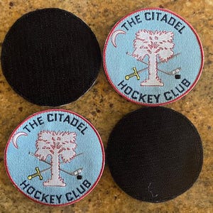 May include: Four embroidered patches, two with a blue background and the text "The Citadel Hockey Club" and a stylized tree, and two black patches.