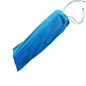 May include: A bright blue velvet drawstring pouch with a soft, textured surface. The bag is elongated and cylindrical in shape, featuring matching blue fabric cords at the top that are pulled tight to secure the opening of the storage container.