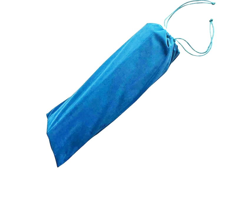 May include: A bright blue velvet drawstring pouch with a soft, textured surface. The bag is elongated and cylindrical in shape, featuring matching blue fabric cords at the top that are pulled tight to secure the opening of the storage container.