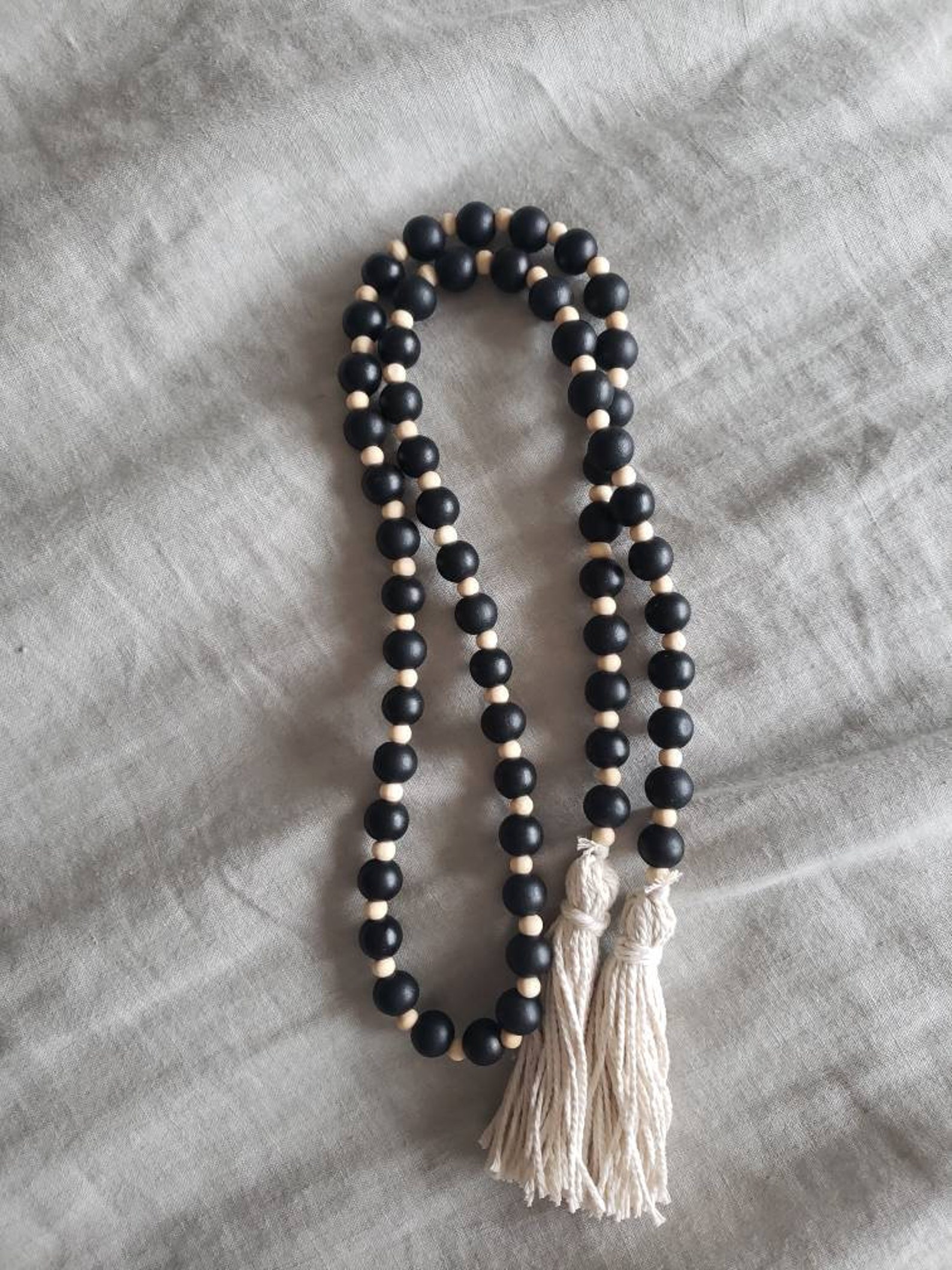Natural and black wood bead garland with tassles | Etsy