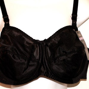 May include: Black underwired bra with adjustable straps and a satin finish. The bra has a tag that says "Bali".