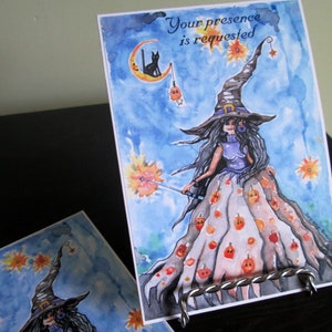 May include: A watercolor painting of a witch with a black cat on a crescent moon. The witch is wearing a purple dress and a hat with a wide brim. The background is a blue sky with stars and pumpkins. The text "Your presence is requested" is written at the top of the card.