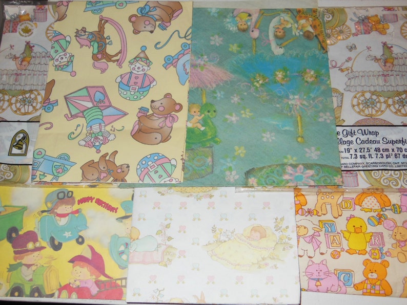 May include: Assortment of vintage wrapping paper featuring various designs, including a clown, a teddy bear, a baby in a cot, and a child on a swing. The paper is printed on a light yellow, light blue, and white background.