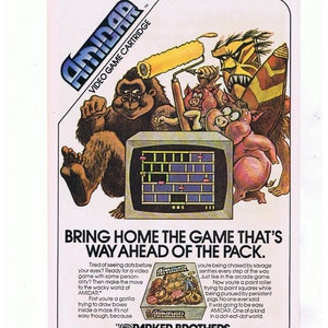 May include: A vintage advertisement for the Amidar video game cartridge. The ad features a gorilla, pigs, and a paint roller. The text reads "Bring home the game that's way ahead of the pack." and "Amidar. One of a kind in a dot-eat-dot world."
