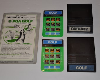 May include: A selection of vintage Intellivision video game cartridges and related items. Includes PGA Golf and Lock 'N Chase cartridges, plus instruction booklets. The Golf cartridges have a green and blue design.