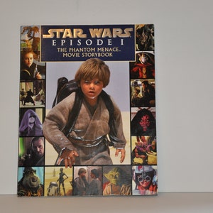 May include: A Star Wars Episode I: The Phantom Menace movie storybook with a collage of images from the film on the cover. The cover features a young boy in a brown robe, a green alien, and a red-haired woman.