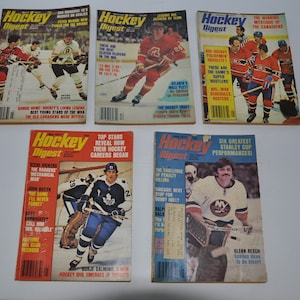 May include: A collection of six vintage Hockey Digest magazines featuring hockey players on the covers. The magazines are from the 1970s and feature players like Borje Salming, Glenn Resch, and the Montreal Canadiens.