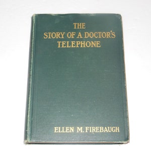 May include: A green hardcover book titled "The Story of a Doctor's Telephone" by Ellen M. Firebaugh.