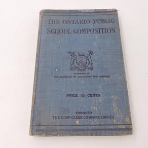 May include: A vintage blue book titled "The Ontario Public School Composition." The cover features text, a coat of arms, and the text "Price 15 Cents." Published by The Copp Clark Company, Limited, Toronto.