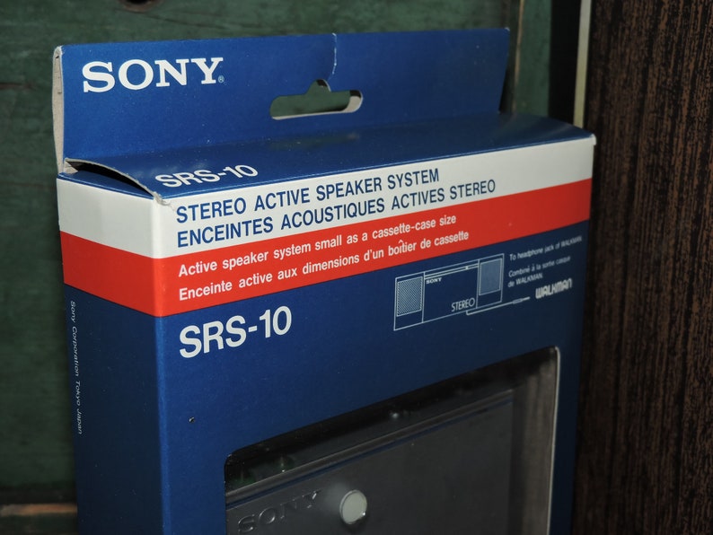 May include: A blue and red box with the text "SONY" and "SRS-10" printed on it. The box is for a stereo active speaker system that is the size of a cassette case. The box also has a picture of the speaker system on it.