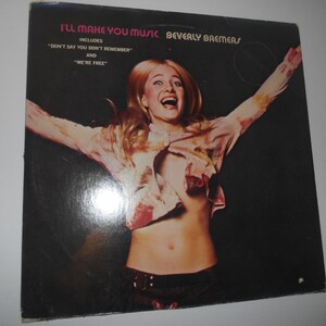 Puede incluir: Portada de álbum de vinilo vintage para "I'll Make You Music" de Beverly Bremers. La portada presenta a una mujer con cabello rubio y una blusa rosa sobre un fondo negro. El título del álbum y el nombre del artista están en la parte superior.