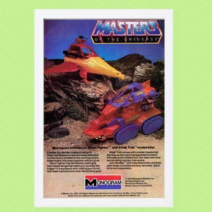 May include: Masters of the Universe Talon Fighter and Attak Trak model kits from Monogram. The Talon Fighter is a yellow and orange spaceship with a rotating gun turret. The Attak Trak is a red and blue tank with crawler treads.