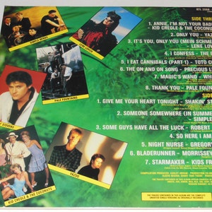 May include: A green and white record album cover with a jungle theme. The front cover features a list of songs on each side of the record, with the artists' names listed next to each song title. The album is titled 'RTL 2008-8'.