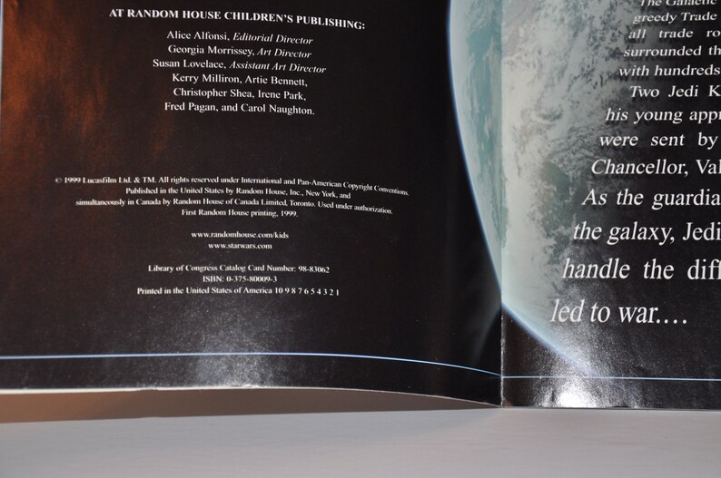 May include: A black and white image of a book open to a page with text about the Star Wars universe. The text reads "As the guardians of the galaxy, Jedi Knights were sent by Chancellor, Valorum, to handle the difficult situation that led to war..."