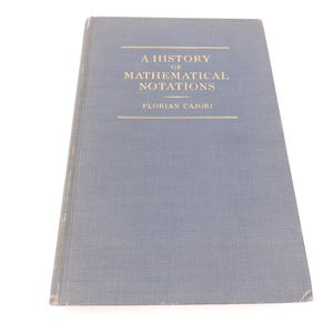 May include: A History of Mathematical Notations by Florian Cajori. The book has a blue cover with gold lettering. The title and author's name are displayed prominently on the cover.
