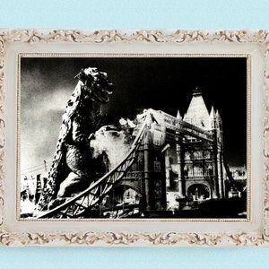 May include: A black and white photograph of a giant monster destroying the Tower Bridge in London. The monster is a large, reptilian creature with sharp teeth and claws. The bridge is partially collapsed, with debris scattered around the base.