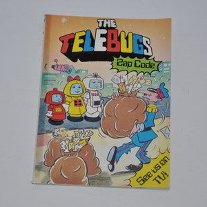 Puede incluir: Una portada de cómic con cuatro personajes de dibujos animados llamados "The Telebugs" con el título "Zap Code" y el texto "See us on TV!"