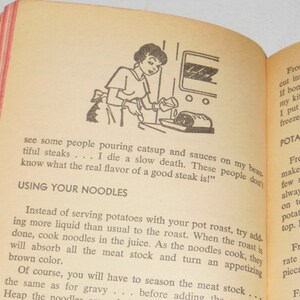 May include: A vintage cookbook with a red and white striped cover. The book features a black and white illustration of a woman pouring gravy over a roast. The text on the page reads "Using Your Noodles" and "Potato Topping".