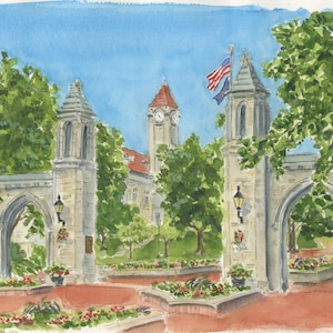May include: Watercolor painting of a university entrance with stone archways, a red-roofed building, and an American flag. The scene is framed by lush green trees and flower beds, under a bright blue sky.