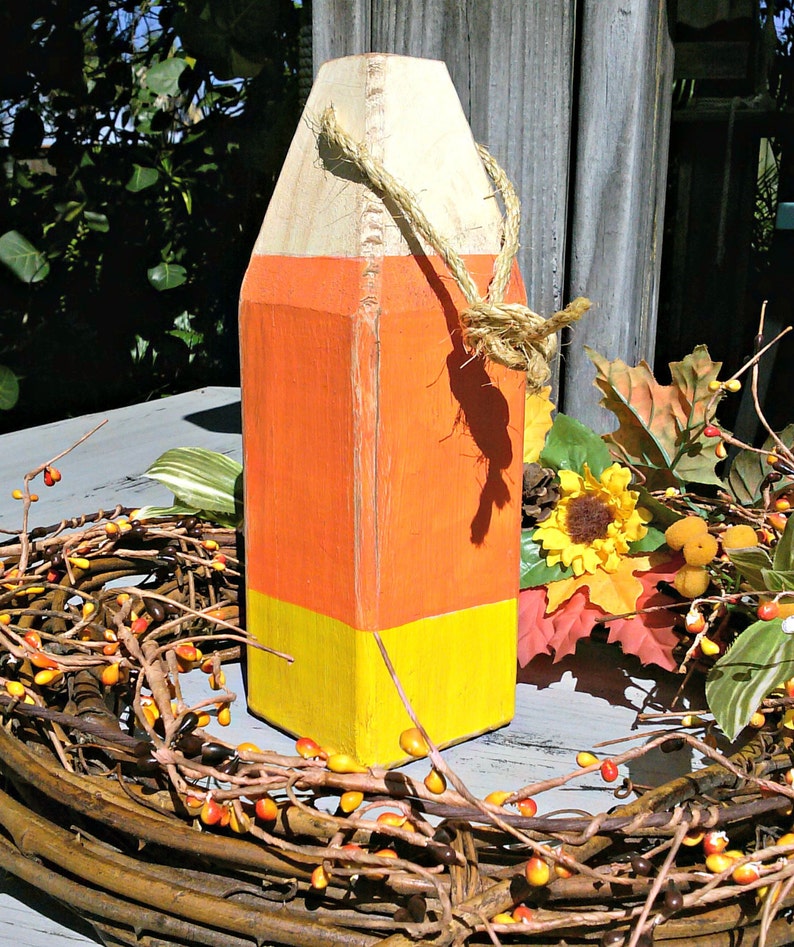 Candy corn, fall decor, halloween decor, wooden buoy, orange, yellow image 1