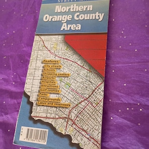 May include: A folded street map titled "Northern Orange County Area" from the Automobile Club of Southern California. The map features a detailed layout of city streets, schools, shopping centers, airports, hospitals, attractions, golf courses, parks, campgrounds, and lakes.