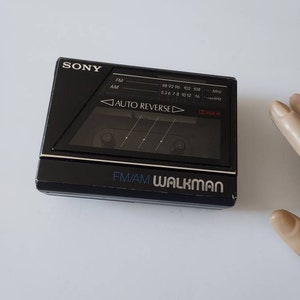 Sony FM/AM Radio Walkman Auto Reverse WM-F77 Cassette Player for Repairs or Parts (Cassette Not Working, Radio Works) & Instructions Booklet