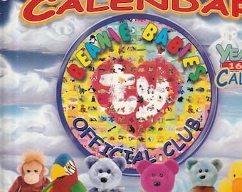 May include: A colorful Beanie Babies Millennium Calendar cover with various plush toys. The calendar features a large circular design with the words "Beanie Babies" and "Official Club." Several plush toys, including a monkey, parrot, and bears, are displayed at the bottom.