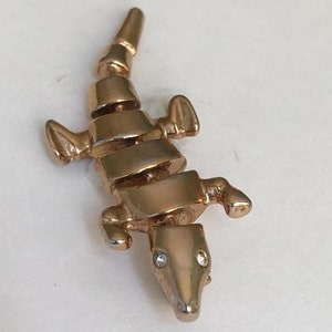 Vintage rhinestone alligator pin in gold-tone metal