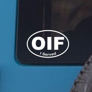 May include: A white oval sticker with the text "OIF I Served" on a blue car.