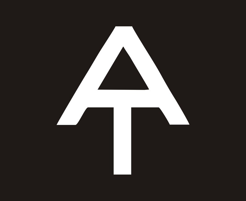 May include: White stylised letter A with a T underneath, forming a symbol that resembles a mountain peak.