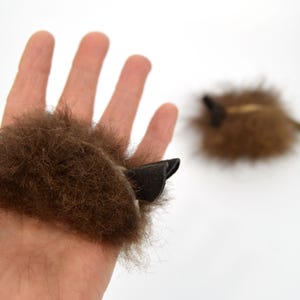 real buffalo bison fur cat toy mouse in hand to show size