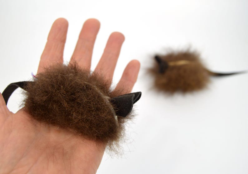 real buffalo bison fur cat toy mouse in hand to show size